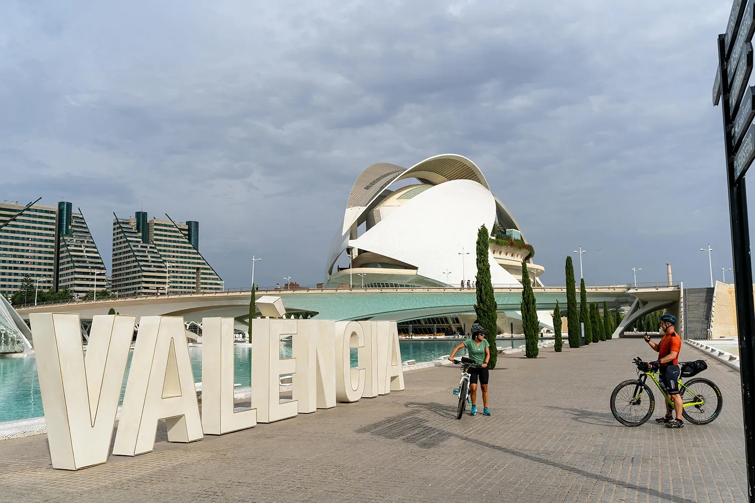 A group of tourists taking a bike city tour at the City of Arts and Sciences in Valencia